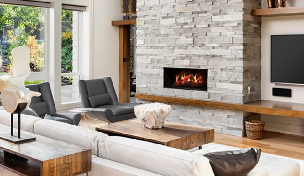 Dimplex Opti-V Electric Fireplace shown in modern living room with stone facade and wood beam hearth.