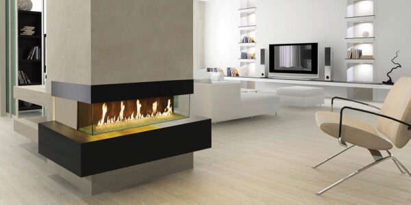 DaVinci Bay Linear Fireplace in white with wooded floors. Flame is visible on three sides with dancing gas fed fire by Dreifuss Fireplaces