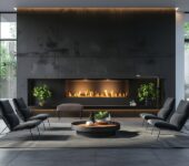 A modern living room with a sleek built-in electric fireplace, featuring comfortable chairs, a round coffee table, and indoor plants, all set against a dark accent wall with large windows bringing in natural light.