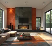 A modern living room with a gas fireplace set against a bold orange accent wall, filled with natural light.