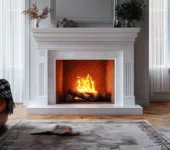 Classic fireplace with a roaring fire, exploring which type is the best for your home.