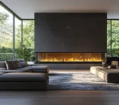 A contemporary living room featuring a sleek, linear gas fireplace with vibrant flames set against a dark, minimalist wall. The room is furnished with modern, low-profile seating and a plush area rug. Large floor-to-ceiling windows provide a stunning view of lush greenery, creating a seamless blend of indoor and outdoor spaces. Propane Gas Setup in Pennsylvania