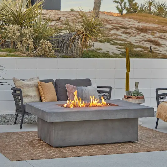 Modern Outdoor Fire Table with Cozy Patio Seating in a Desert Landscape