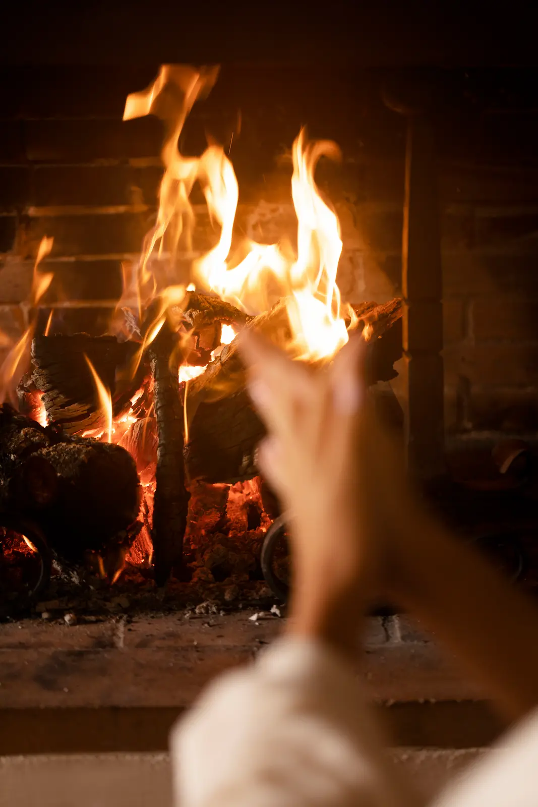 Hands Getting Warmer By Fire Close Up